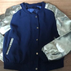 Blue and gold jacket.